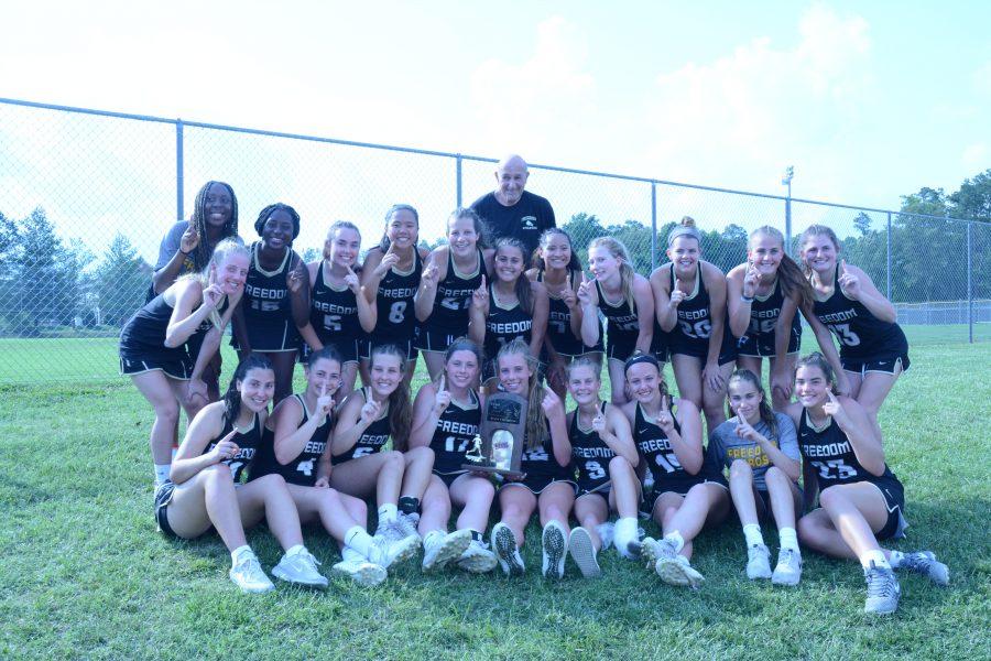 The Freedom Girls Varsity Lacrosse team poses with their State trophy. Lacrosse photos by Kelly Novotny