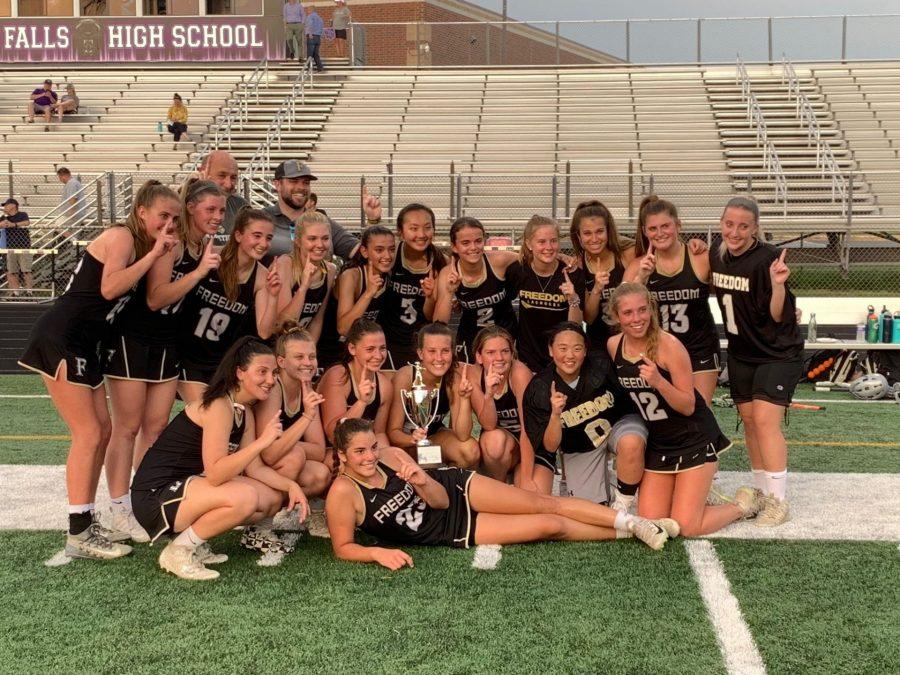 Varsity+Girls+Lacrosse+win+the+Regionals+trophy+after+a+long+neck+and+neck+game.