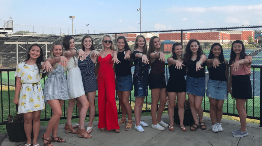 The State Champions pose with a new addition, rings!