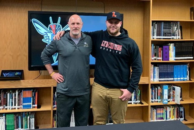 Coach Charles Alcorn (Left) supporting Sam Masters at his signing. (Photo provided by Sam Masters).