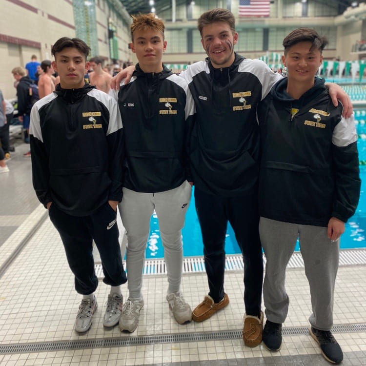 Freshman Kim-Long Nguyen and seniors Jonathan Ung, Gabe Fisher and Alex Shen after breaking the 200 yard medley record. Photo provided by Jonathan Ung.