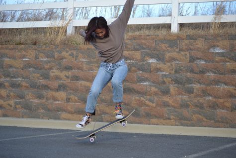 Freedom Senior Samantha Tiong practices a trick on her skateboard. Photo by Karen Xu.