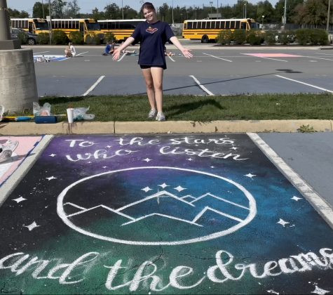 Senior Sydney Munsell finishes her parking spot! Though it took a great deal of time, the final product was amazing! Photo by Rebecca Cherian.