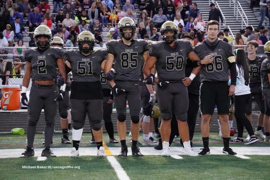 Captains (L-R) Jay Gary, Bryan Guzman, Cole Reemsnyder, Brandon Wilson and Caspian Bell walk out for the coin toss during the Homecoming game against Battlefield on Friday, Oct. 1. Photo by Michael Baker III.