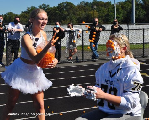 Sophomores Jenna Michaels and Emily Knowles participate in a game during the Homecoming pep rally. 
