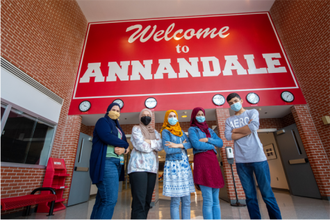 Annandale High School Afghan Refugee students in front of the school. Photo credit to FCPS Office of Communication and Community Relations.
