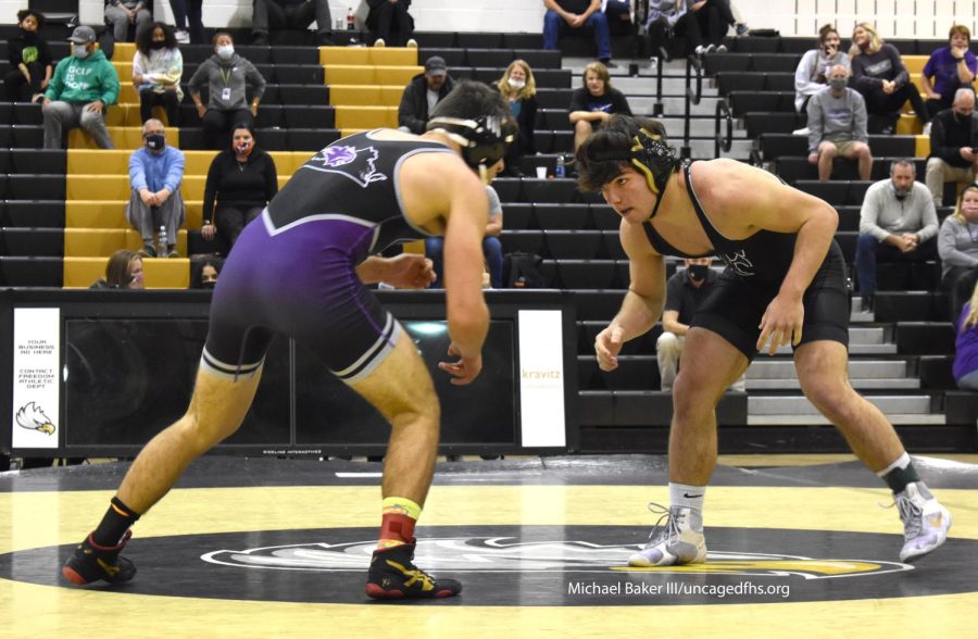 Junior Braden Scrivo faces off against a Battlefield opponent in the 170 pound weight class during the Dec. 16 match at Freedom High School.