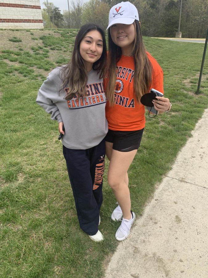 Aayushma Pradhan and Sami Kang pose in their UVA gear. 