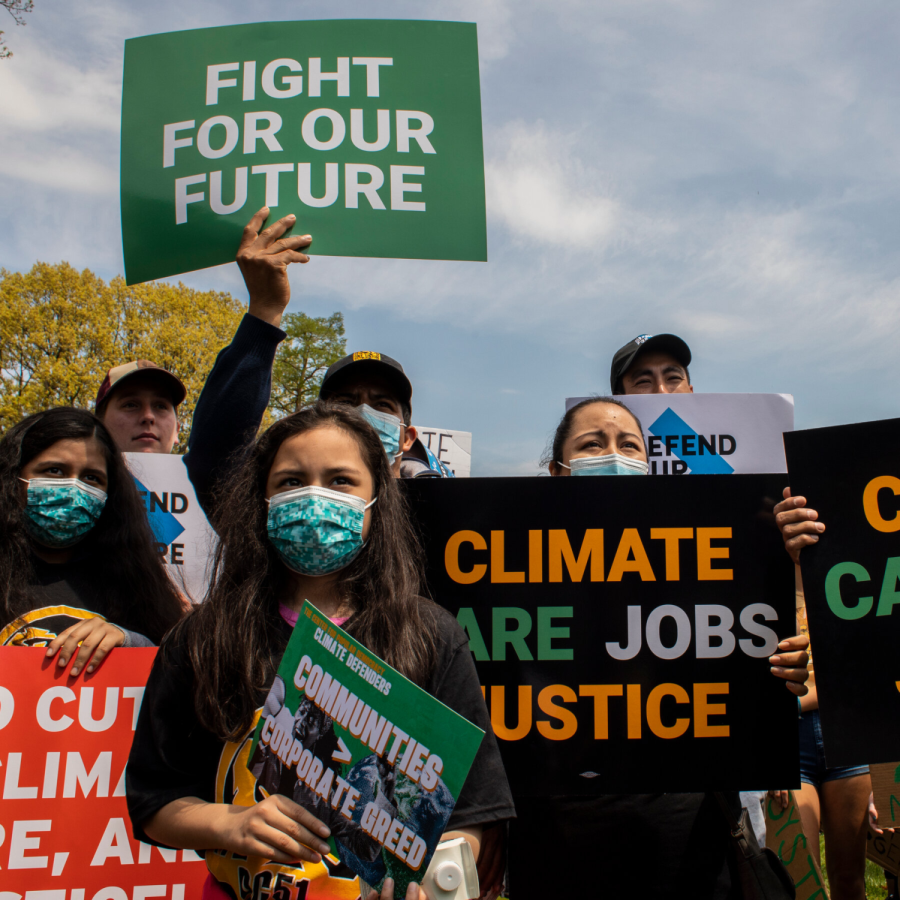 People protest against climate change near the the White House.