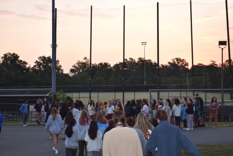 Seniors gathered outside the baseball field to watch the sun rise on their final year of high school.
