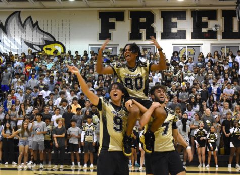 Freedom High School football players hype up the crowd during the Homecoming Pep Rally.