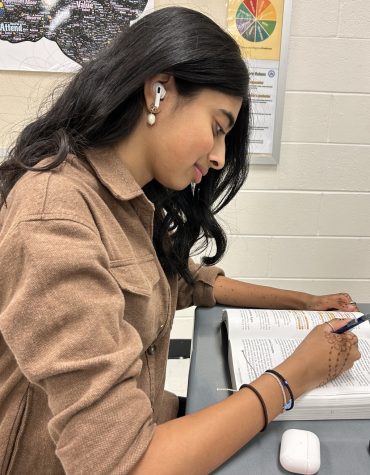 Kaushi Ellinedi, a sophomore at Freedom High School, listens to music while studying for her upcoming AP World History test.