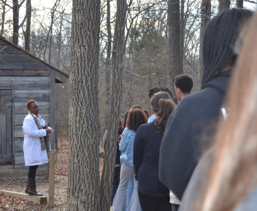 Students gather to see Pastor Michelle talk about a historically black schoolhouse.