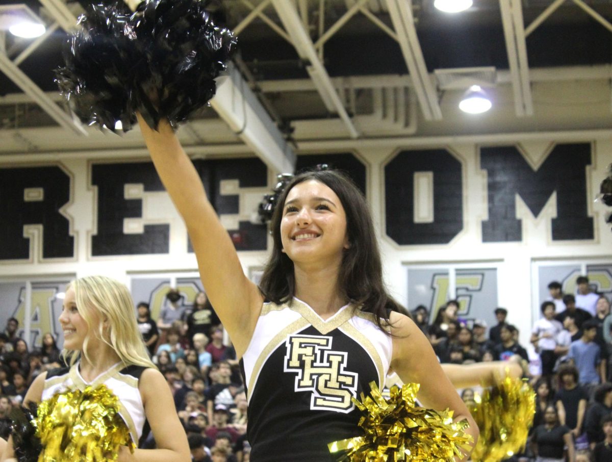 Freedom+senior%2C+Sienna+Simone%2C+performs+with+the+FHS+cheer+team+at+the+Aug.+25+pep+rally.