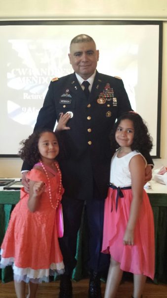 My sister and I at our dad military retirement ceremony in 2014.