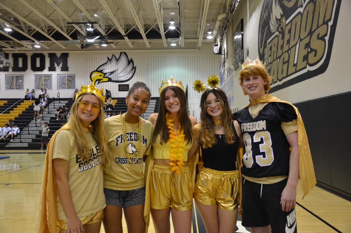 Junior+class+officers+Ava+Christopher%2C+Fiker+Temesgen%2C+Riley+Walsh%2C+Brogan+Wyman+and+Chase+Triplett+dress+up+for+the+Homecoming+Spirit+Week+in+all+gold.+Photo+provided+by+Zayna+Jamil.