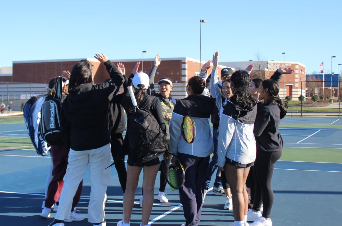 The team showing spirit before beginning the game against Osborne Park.