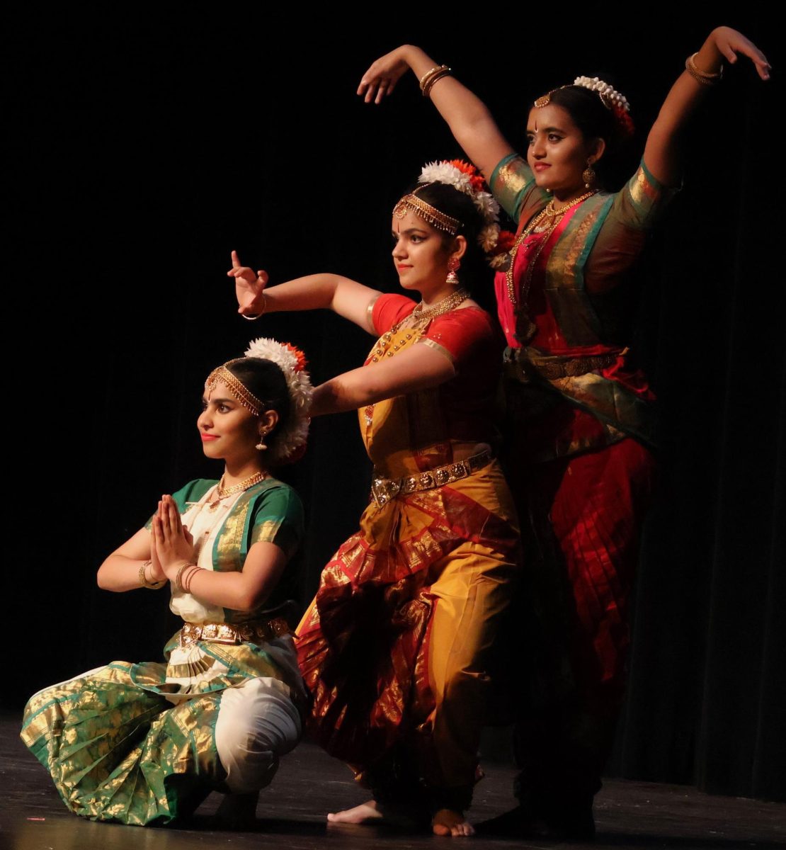 The Bharatanatyam Performance including Deepa Kandukuri, Aarya Ghimire, and Surabhi Mohan performing at the International Festival. 
