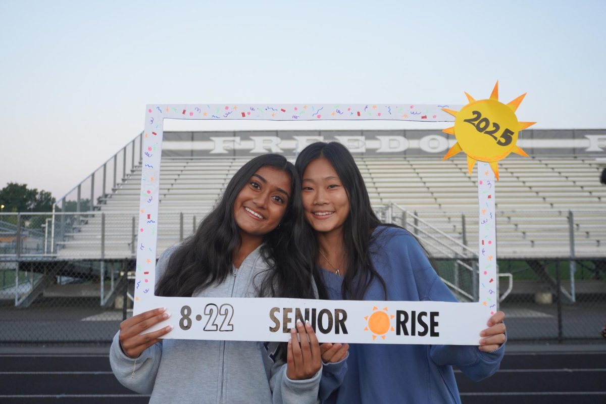 Seniors Mahi Parikh and Alison Mun enjoy senior sunrise before the first day of school starts