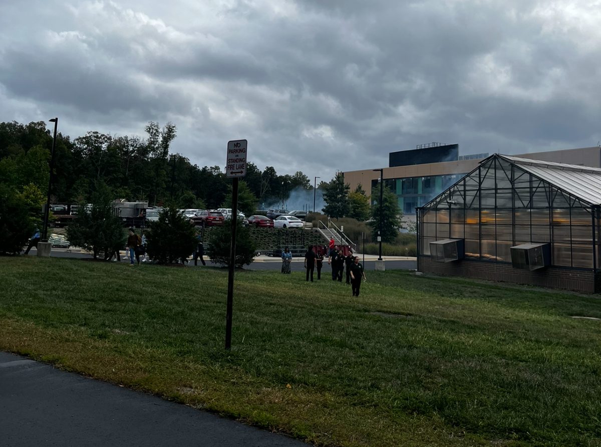 Smoke coming from The Academies of Loudoun seen from where students were standing after evacuation. Photo provided by Jacob Roberts.