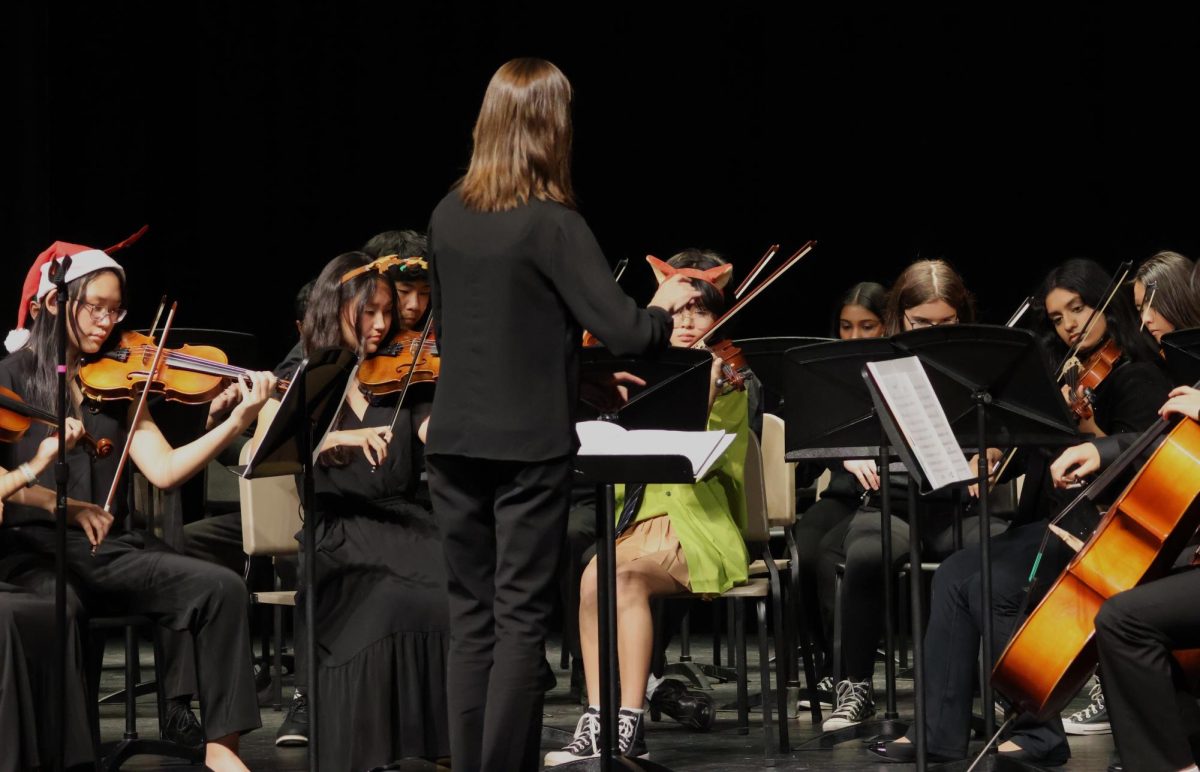 Lillian Green, FHS Orchestra teacher, conducts Orchestras III and IV while they perform Thriller.  