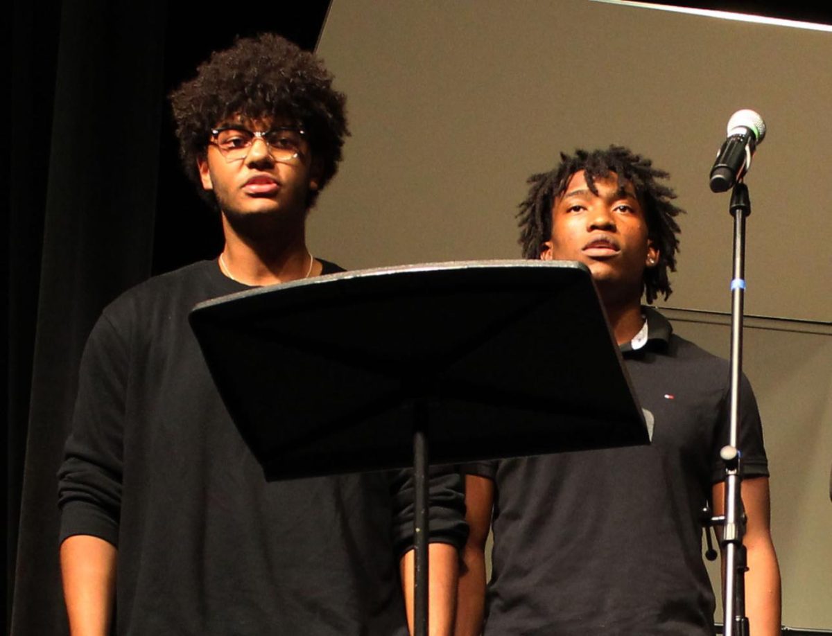 Bass Choir sings "Homeward Bound." Pictured: Aiden Clarke-Babou (Left) and Jeremiah Chery (Right).
