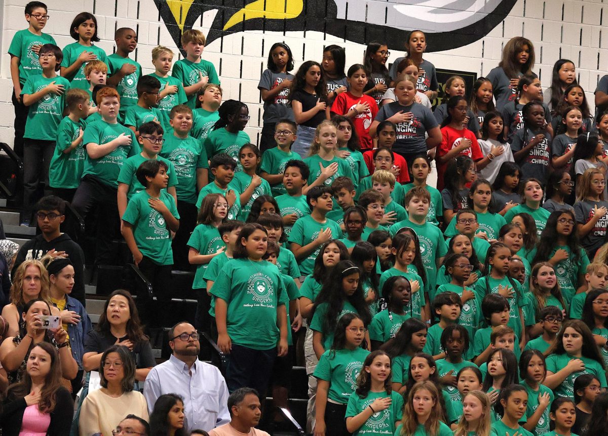 The combined voices of Cardinal Ridge, Hutchison Farm, Liberty and Little River Elementary Schools perform the National Anthem, The Star Spangled Banner. 