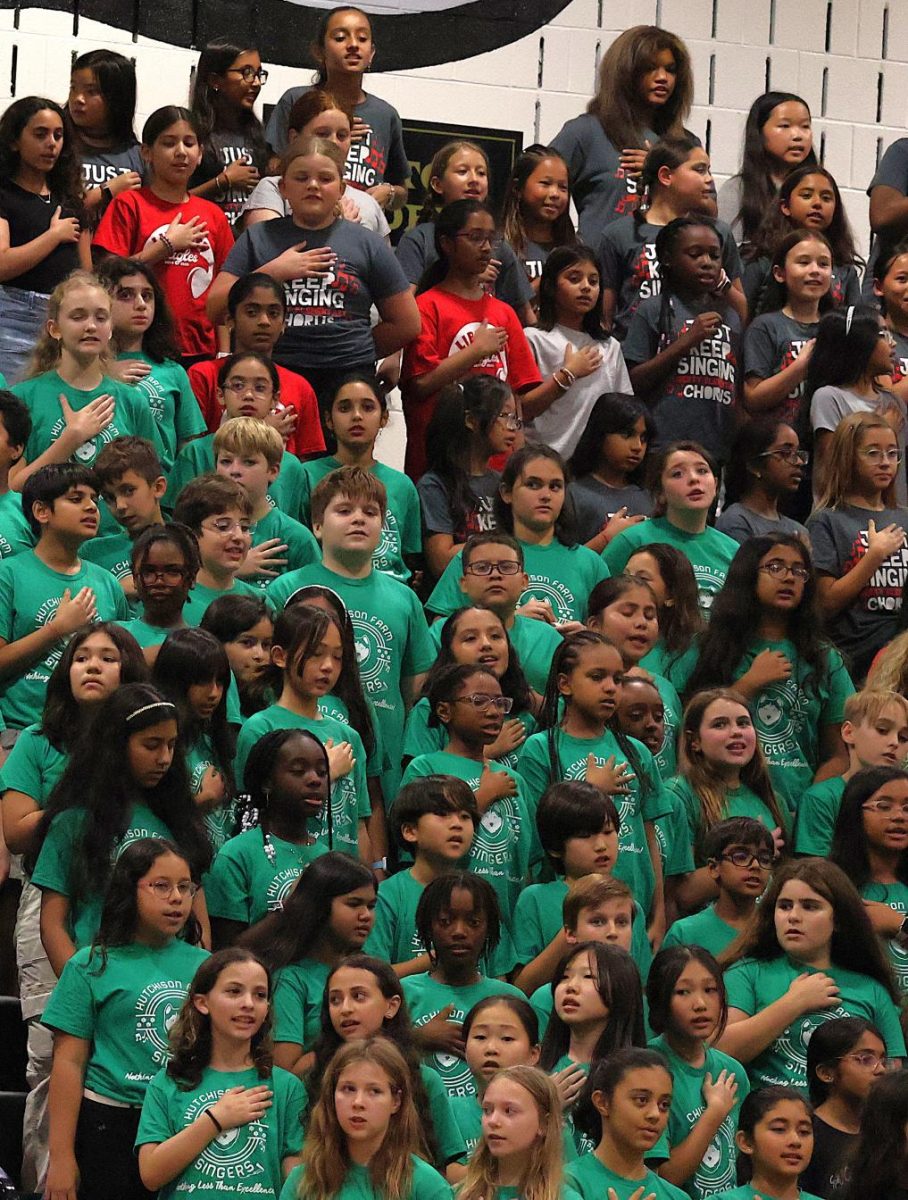 The combined voices of Cardinal Ridge, Hutchison Farm, Liberty and Little River Elementary Schools perform the National Anthem, The Star Spangled Banner. 