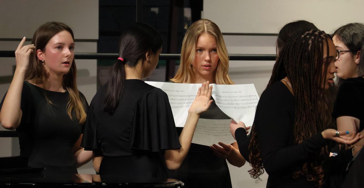 Bella Voce practicing a sight-reading exercise. 