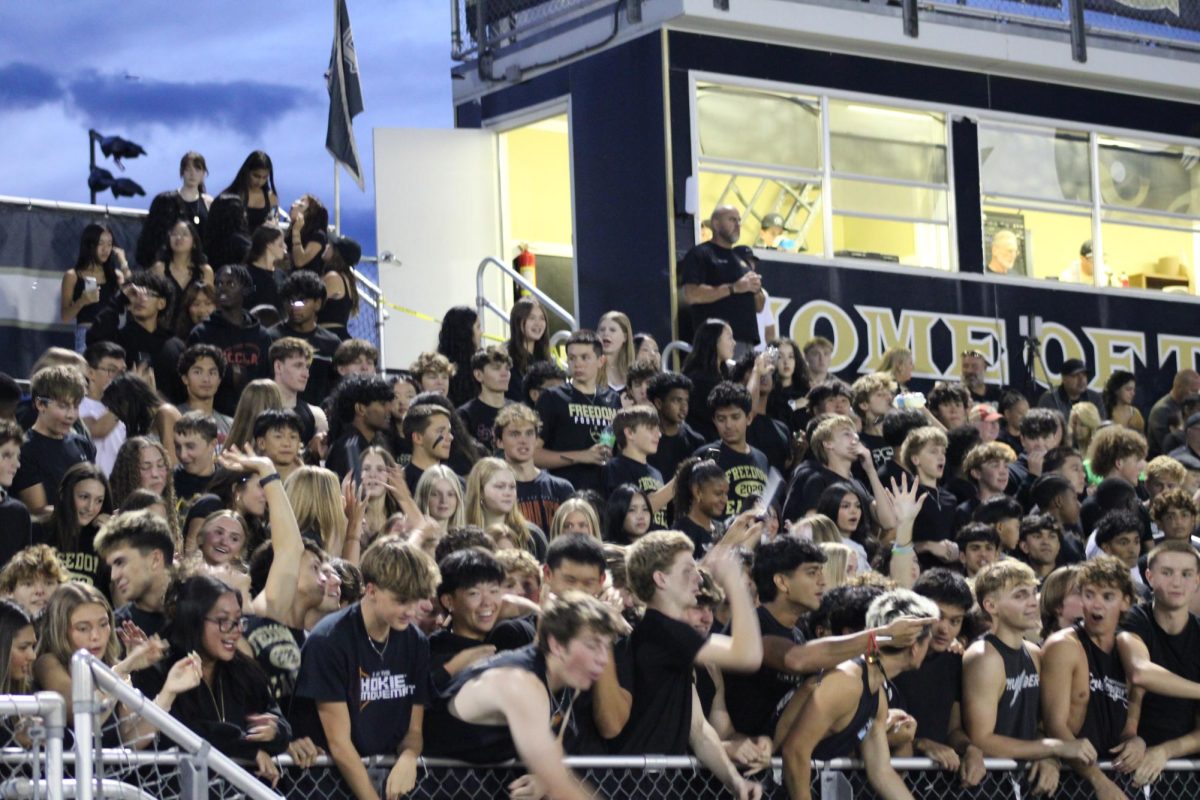 Freedom's student section dressed up for the Black Out Spirit Day and cheered for the football game. 
