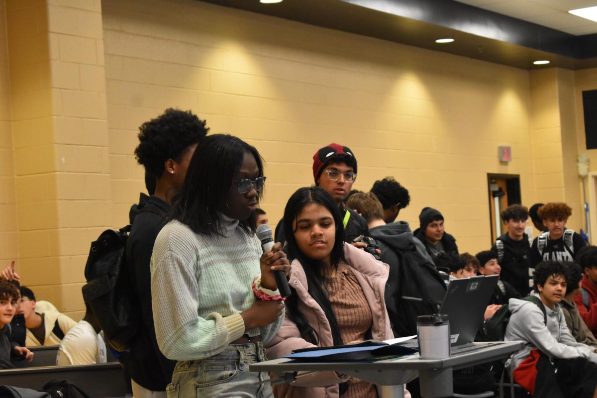 Student leader giving as speech regarding her opinion on ICE